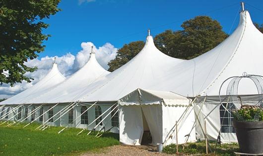 a line of sleek and modern porta potties ready for use at an upscale corporate event in Perry